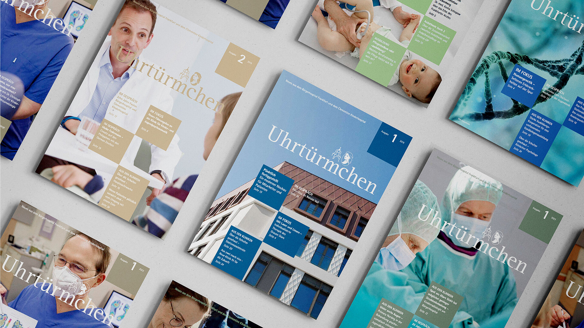 Das Bild zeigt mehrere Cover des Magazins "Uhrtürmchen" in Reihen angeordnet.